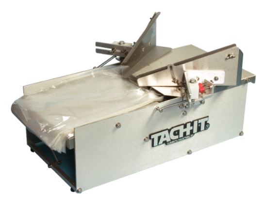 Bread bagging equipment like the TACH-IT 3350A bag opener and other bakery machines are sold by Lenexa Manufacturing Company.